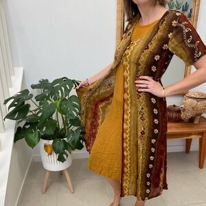 Medium vintage dress. Golden yellow with brown details